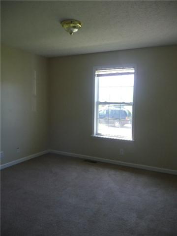 124 Gleaves Lane Oak Grove, KY 42262 - Photo 10 of 14 an empty room with a window