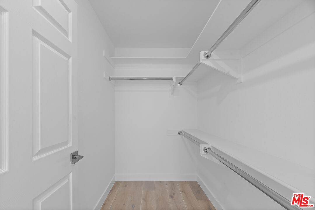 725 North Alfred Street, Unit 202 Los Angeles, CA 90069 - Photo 14 of 28 a view of walk in closet with empty racks