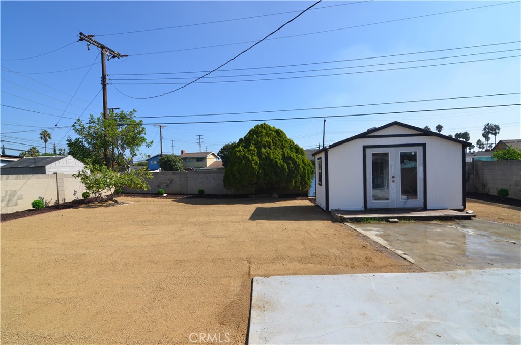 18106 Coltman Avenue Carson, CA 90746 - Photo 11 of 12 a front view of a house with a yard and garage