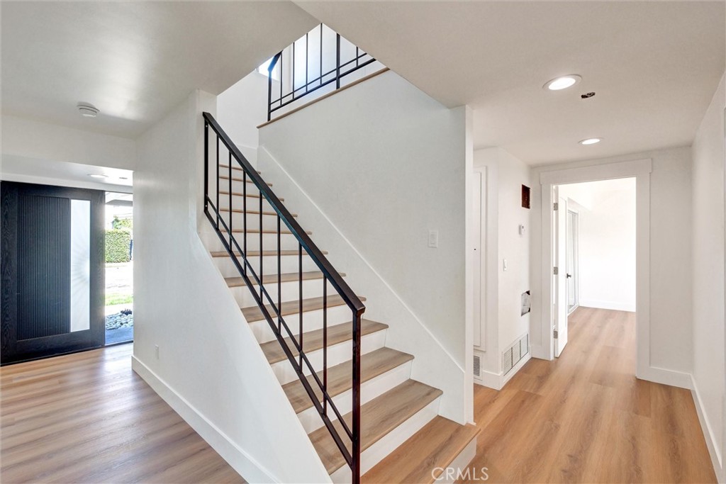 18106 Coltman Avenue Carson, CA 90746 - Photo 7 of 12 a view of an entryway with wooden floor and stairs