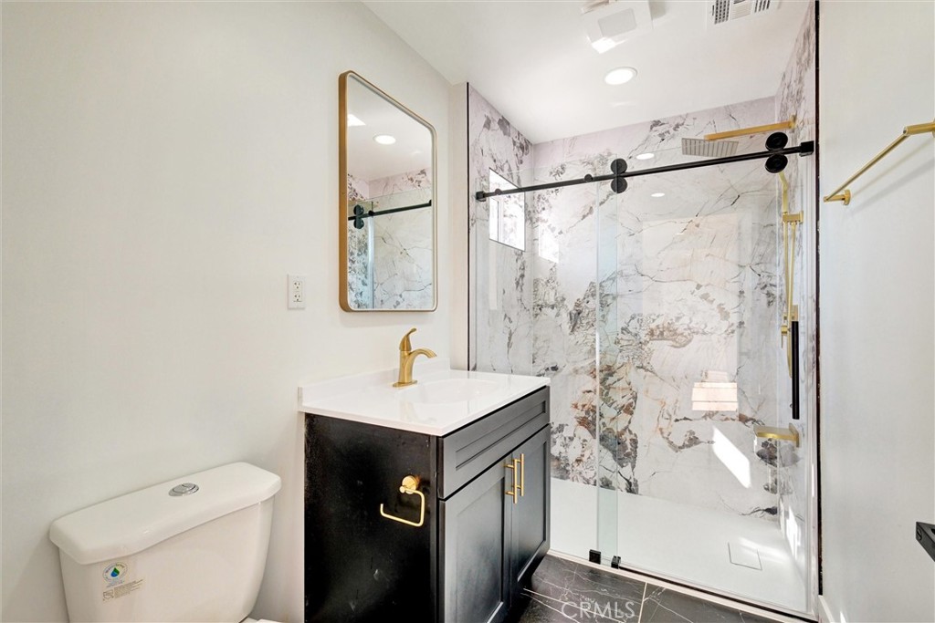 18106 Coltman Avenue Carson, CA 90746 - Photo 10 of 12 a bathroom with a sink toilet and shower