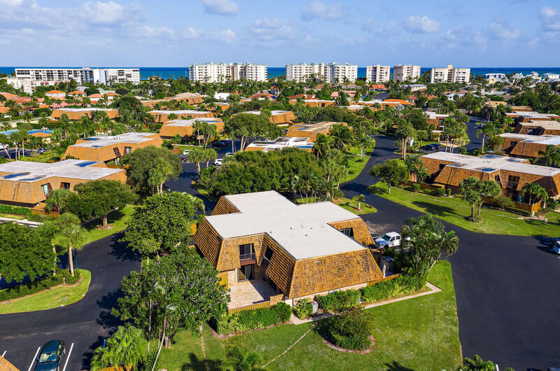 1420 Ocean Way, Unit 6B Jupiter, FL 33477 - Photo 2 of 33 J1 6B Aerial white roofs