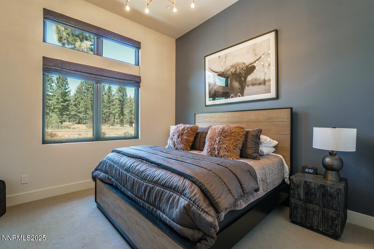 181 Redding Way Carson City, NV 89705 - Photo 27 of 40 a bedroom with a bed and a painting on the wall