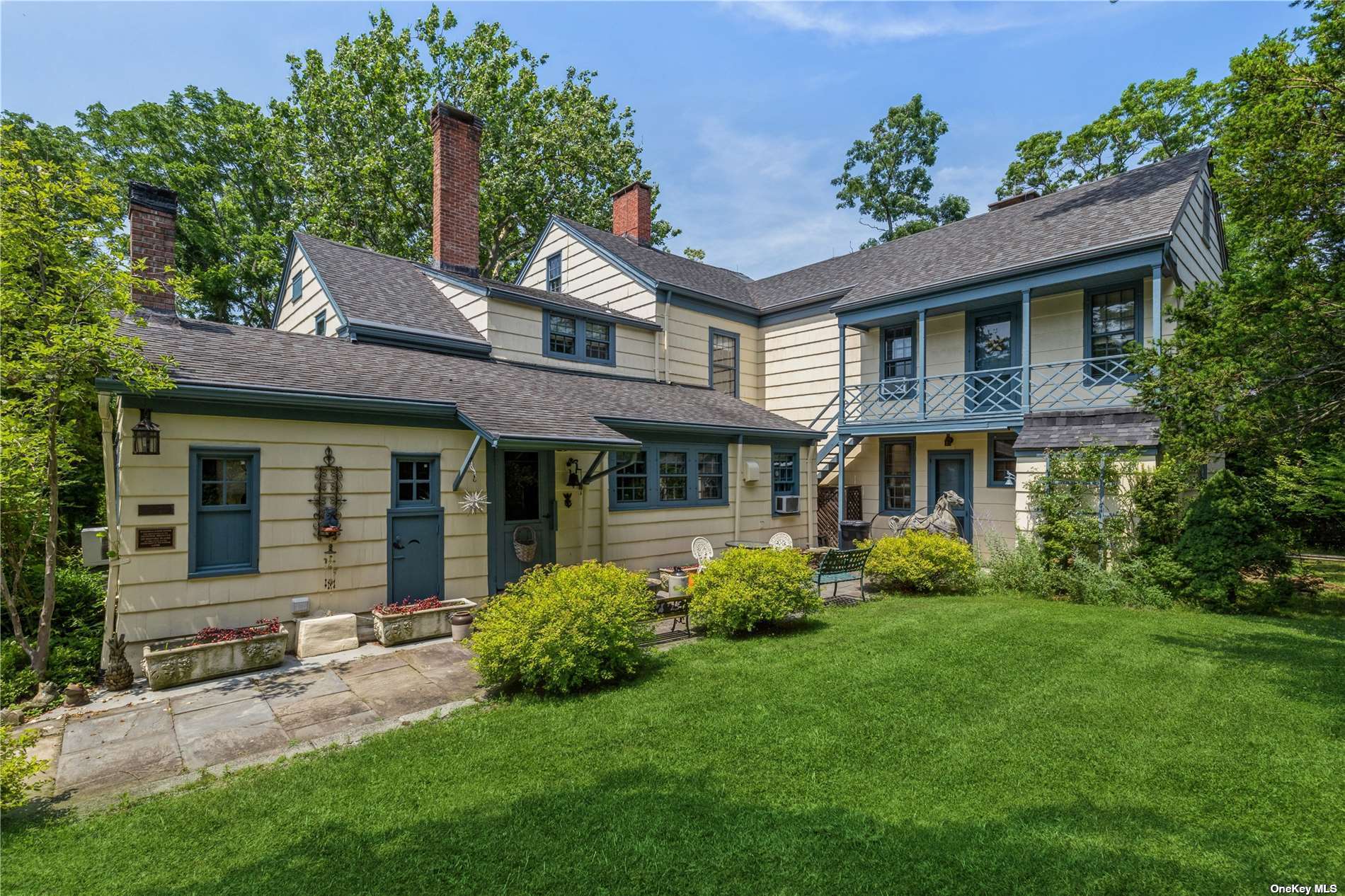 126 Sound Road Wading River, NY 11792 - Photo 1 of 1 a front view of a house with a garden