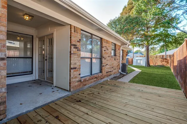 a view of a yard with a tree