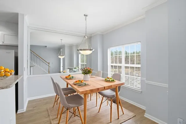 a view of a dining room with furniture window and outside view