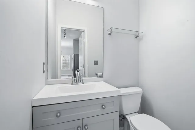 a bathroom with a sink toilet