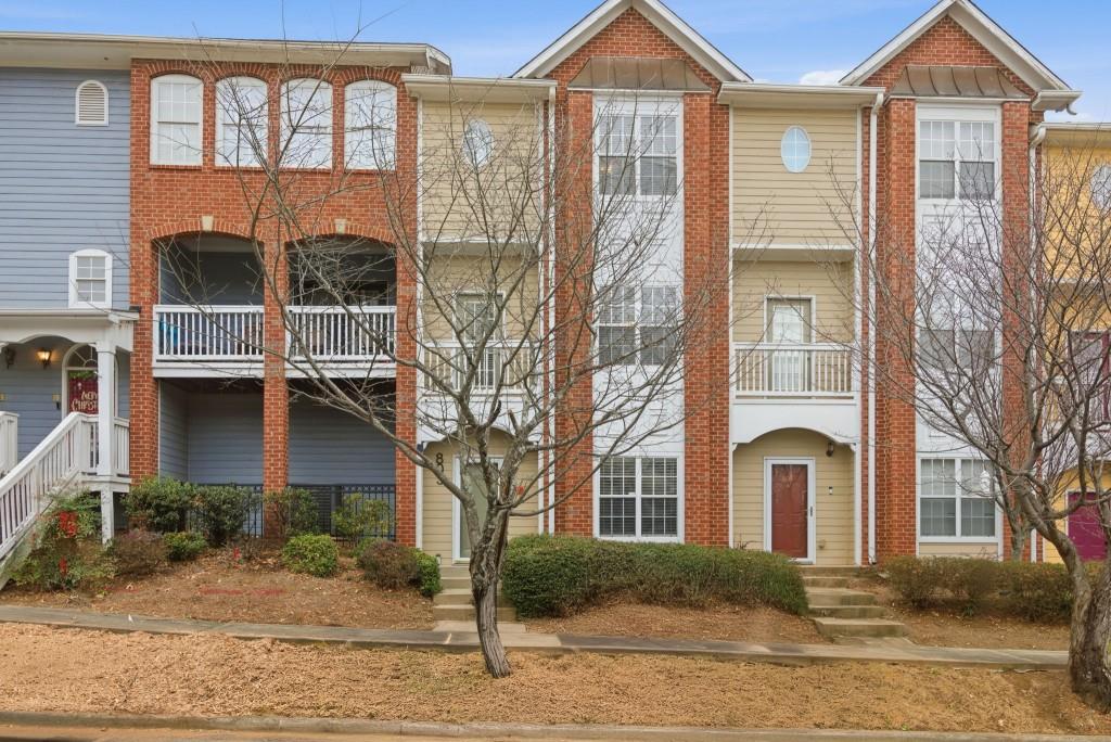 1732 Pryor Road Southwest, Unit 803 Atlanta, GA 30315 - Photo 2 of 26 a front view of a house with a yard