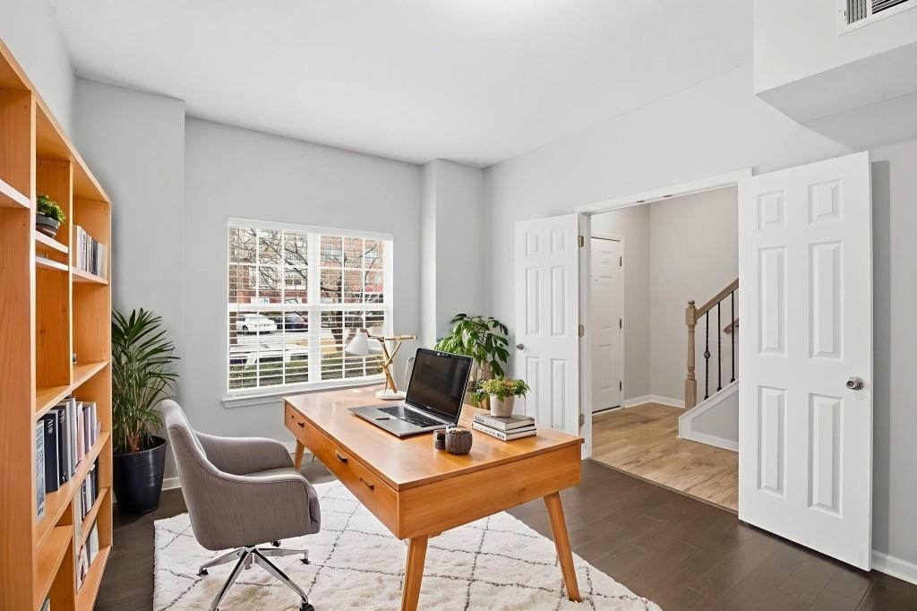 1732 Pryor Road Southwest, Unit 803 Atlanta, GA 30315 - Photo 22 of 26 a living room with furniture and a potted plant