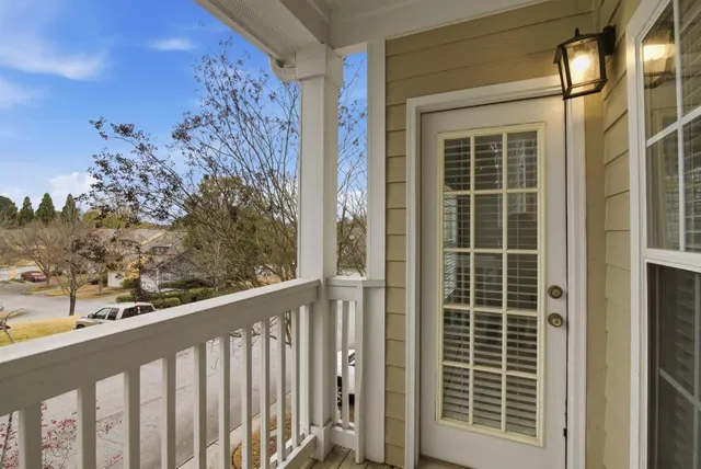 a view of a balcony with a tree