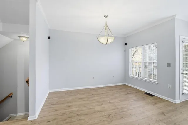 a view of empty room with windows