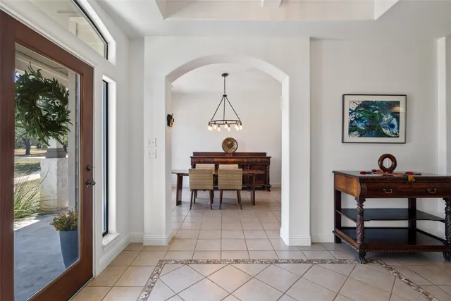 a view of a workspace room with wooden floor and furniture