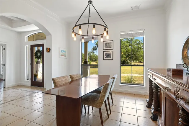 a dining room with furniture and window