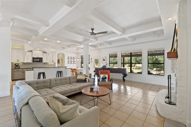 a living room with furniture and a table