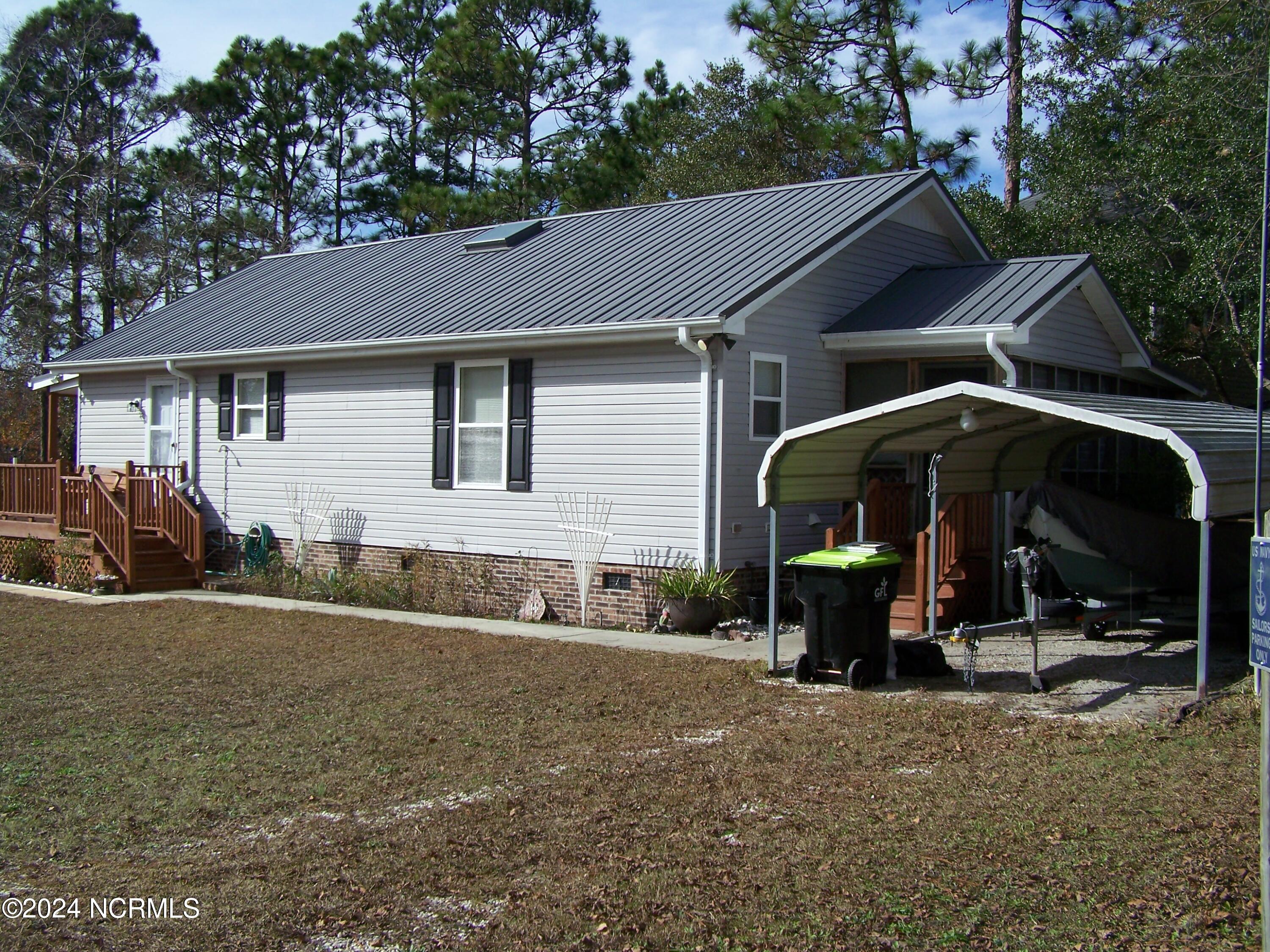 36 North Lake Drive Boiling Spring Lakes, NC 28461 - Photo 34 of 55 Right side rear of home