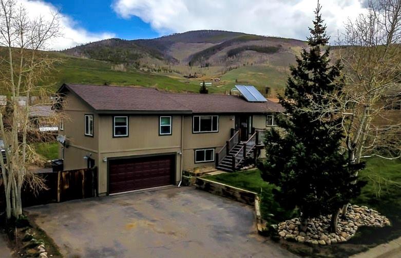 53 Big Elk Road Dillon, CO 80435 - Photo 1 of 33 a front view of a house with garden