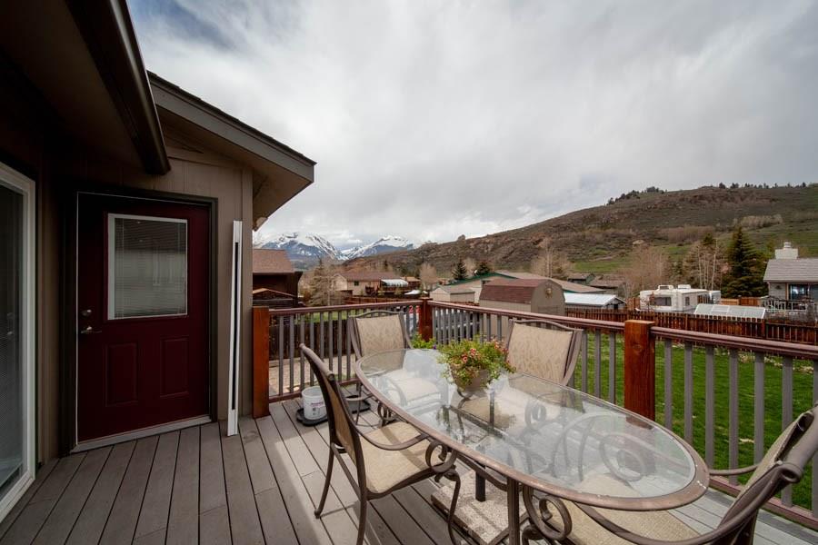 53 Big Elk Road Dillon, CO 80435 - Photo 13 of 33 a balcony with wooden floor table and chairs