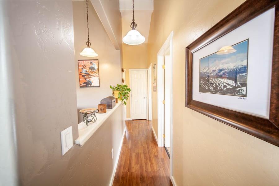 53 Big Elk Road Dillon, CO 80435 - Photo 16 of 33 a view of a hallway with wooden floor