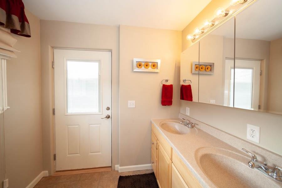 53 Big Elk Road Dillon, CO 80435 - Photo 18 of 33 a bathroom with a sink vanity and mirror
