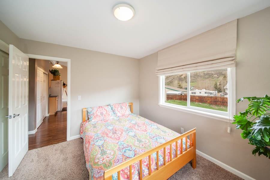 53 Big Elk Road Dillon, CO 80435 - Photo 19 of 33 a bedroom with a bed and a window