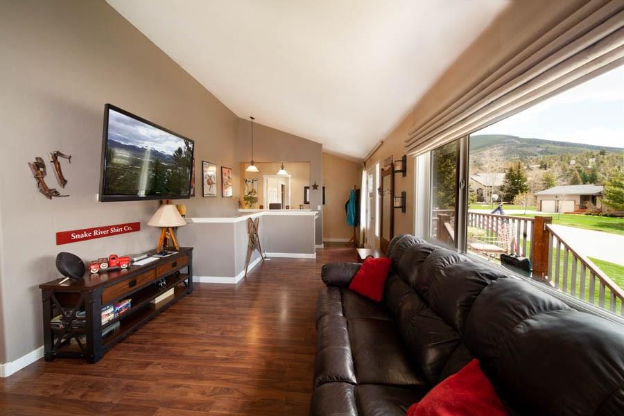 53 Big Elk Road Dillon, CO 80435 - Photo 3 of 33 a living room with furniture and a flat screen tv