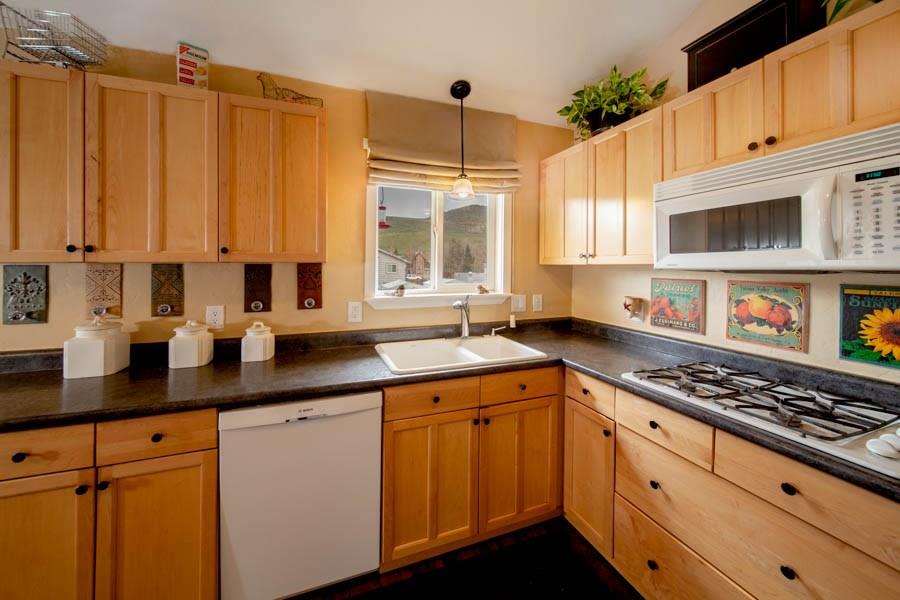 53 Big Elk Road Dillon, CO 80435 - Photo 30 of 33 a kitchen with stainless steel appliances a stove a sink and cabinets
