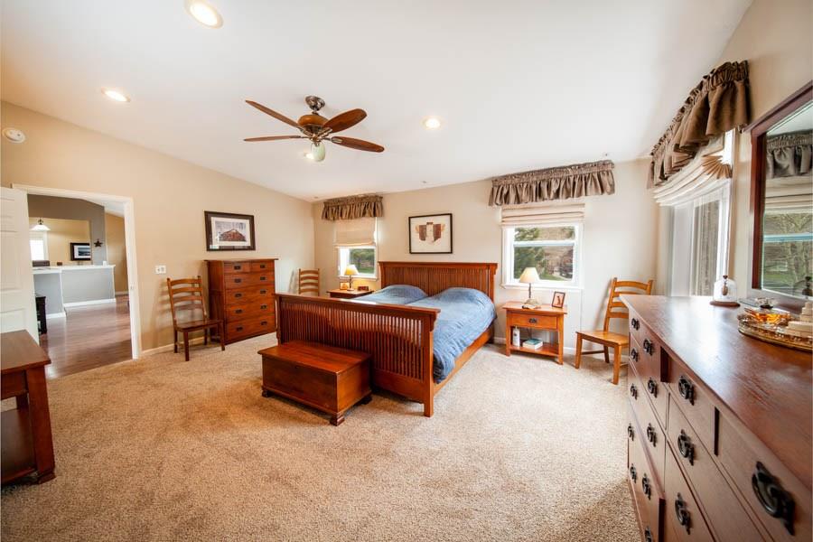 53 Big Elk Road Dillon, CO 80435 - Photo 5 of 33 a bedroom with furniture and a chandelier