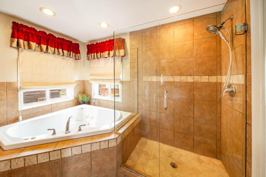 53 Big Elk Road Dillon, CO 80435 - Photo 6 of 33 a bathroom with a bathtub and a shower