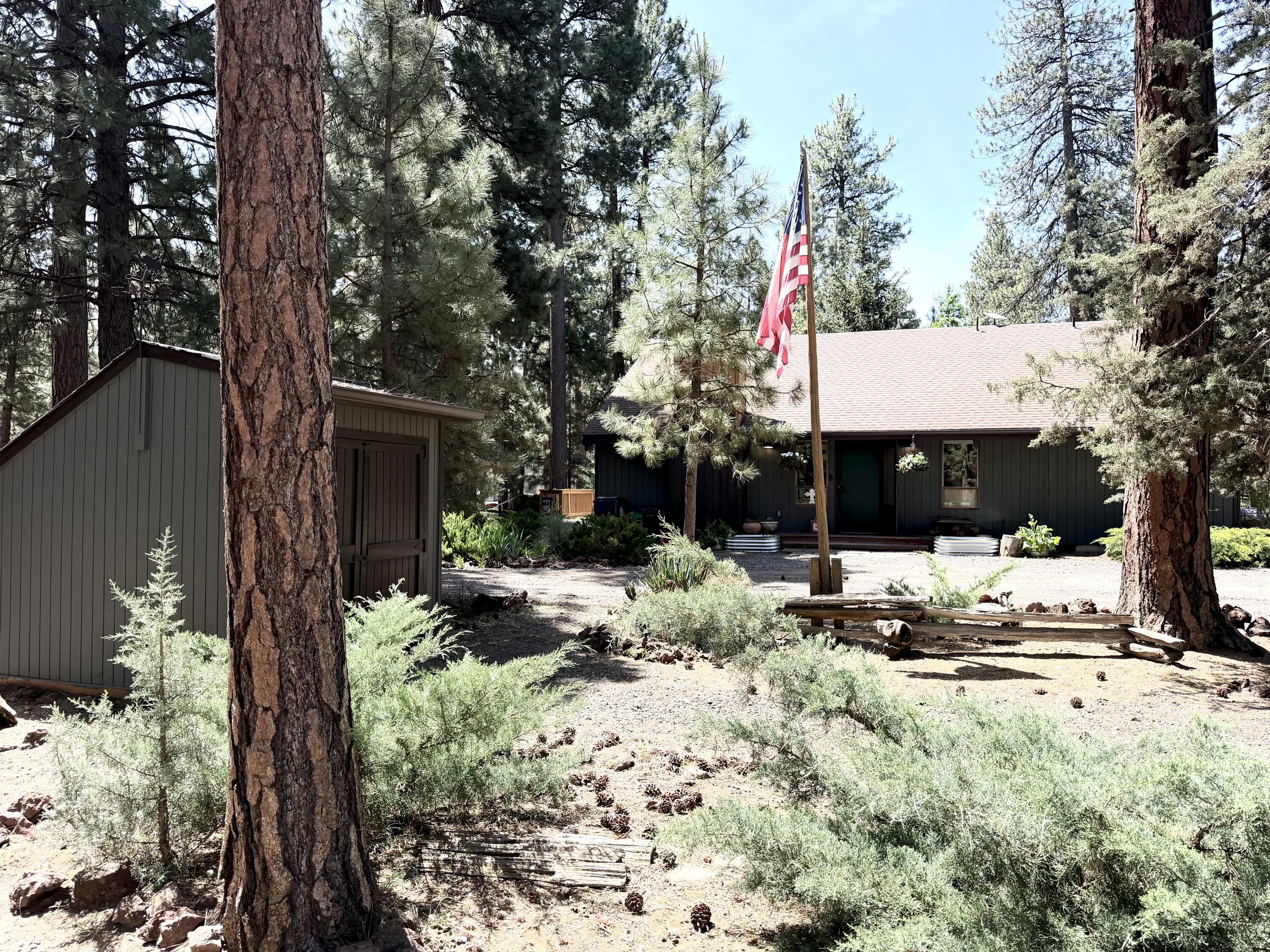 68964 Graham Court Sisters, OR 97759 - Photo 2 of 28 a view of a house with a yard and tree s