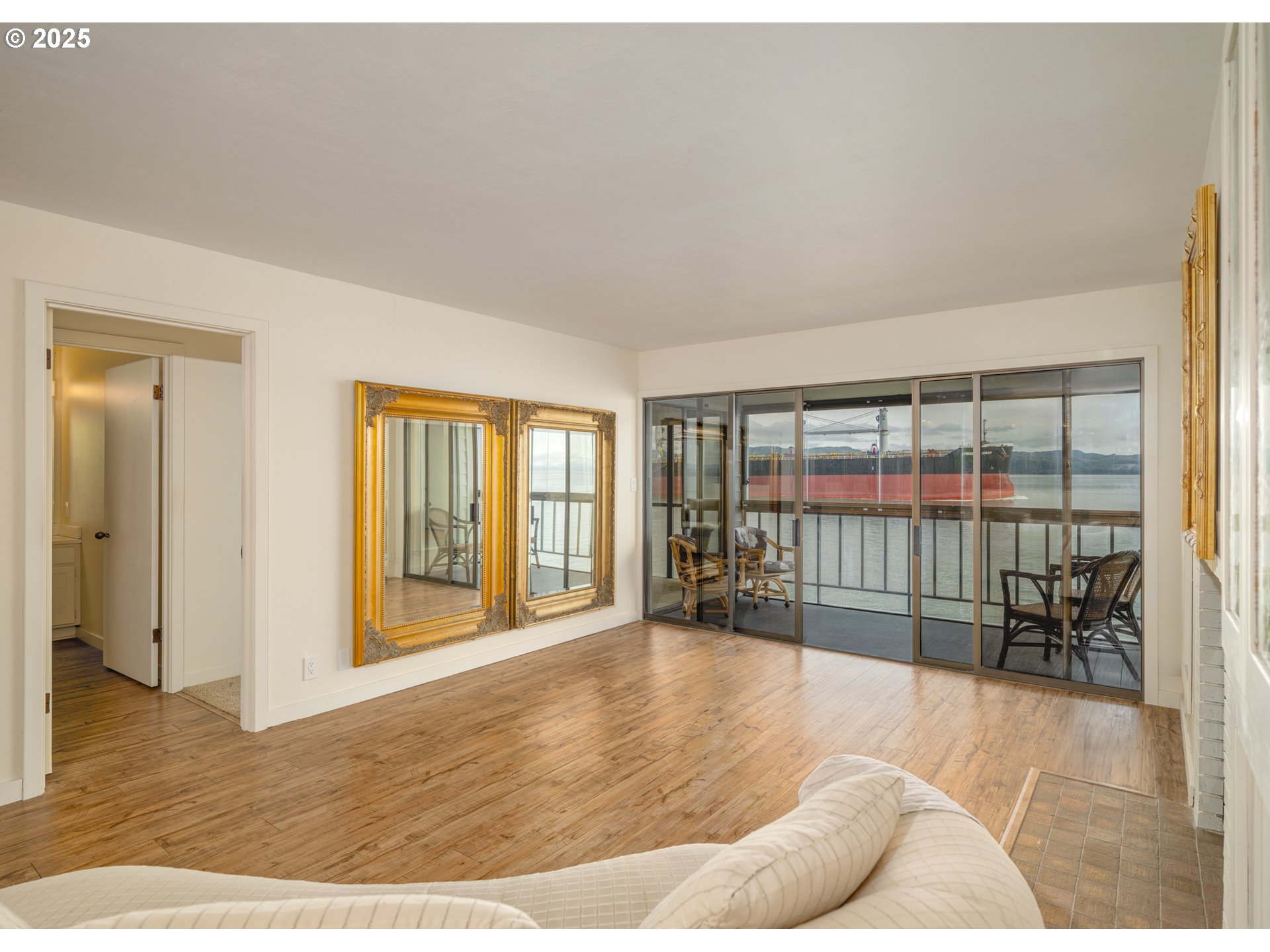 1 3rd Street, Unit 209 Astoria, OR 97103 - Photo 14 of 37 a view of a livingroom with wooden floor and furniture