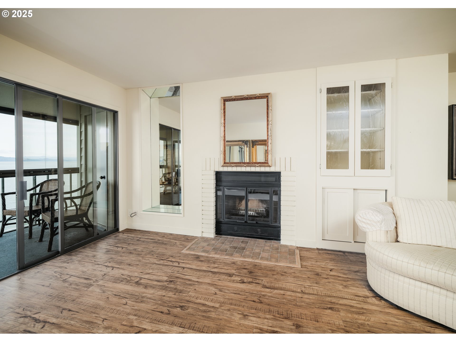 1 3rd Street, Unit 209 Astoria, OR 97103 - Photo 18 of 37 a living room with furniture and a fireplace