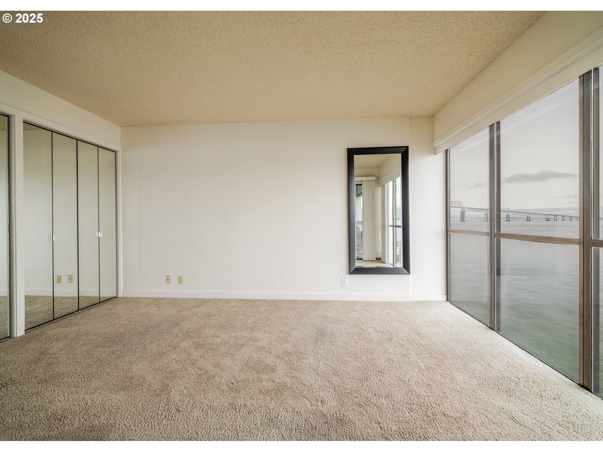 1 3rd Street, Unit 209 Astoria, OR 97103 - Photo 19 of 37 a view of an empty room with a window