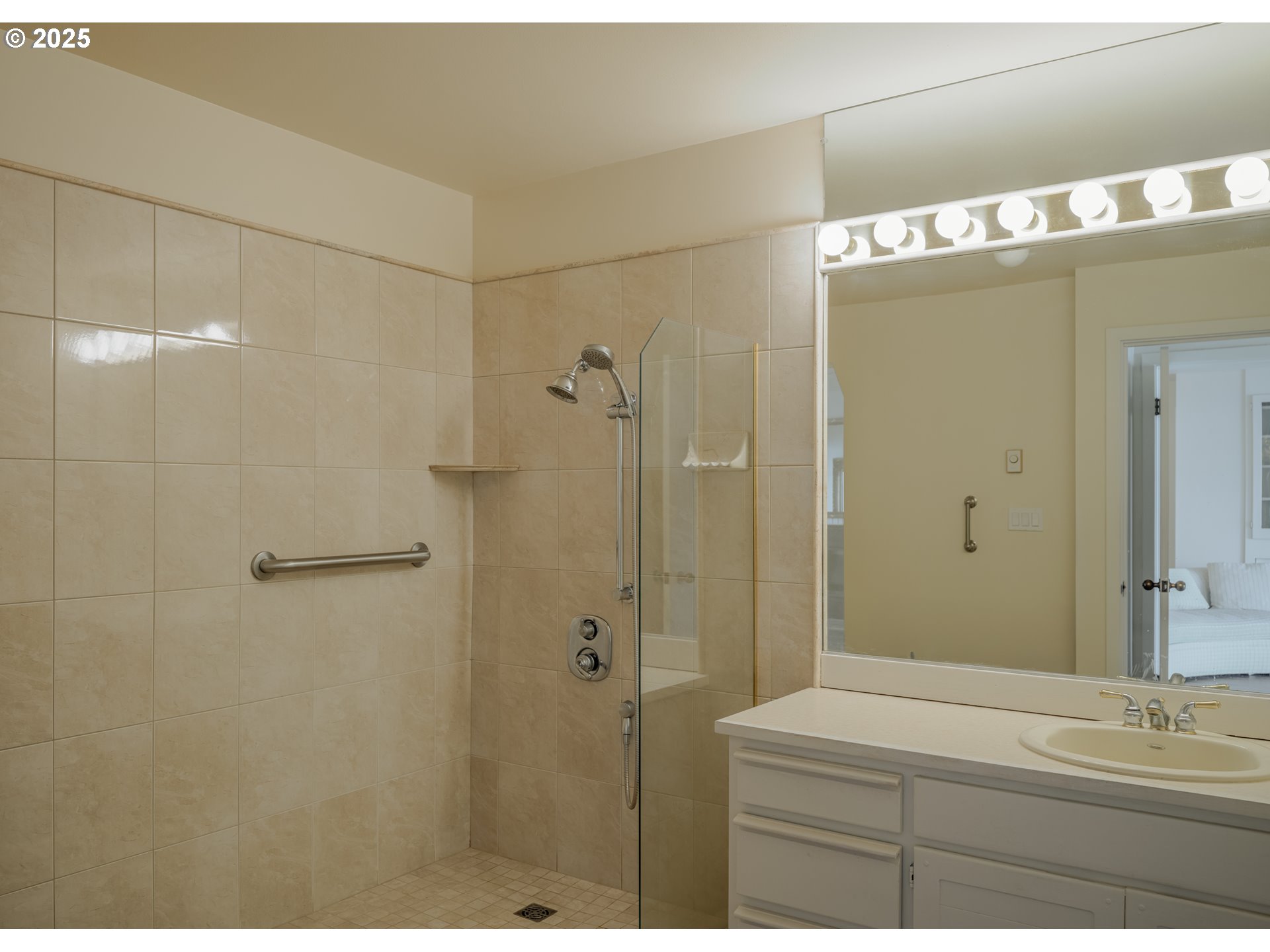 1 3rd Street, Unit 209 Astoria, OR 97103 - Photo 21 of 37 a bathroom with a sink mirror and shower