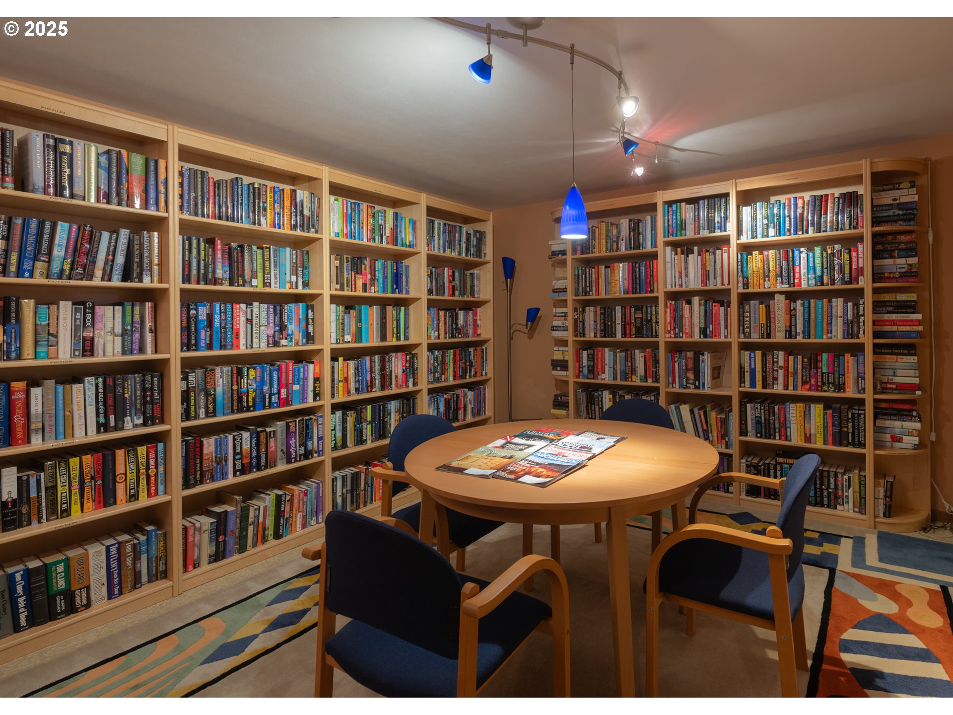 1 3rd Street, Unit 209 Astoria, OR 97103 - Photo 28 of 37 a view of a workspace with furniture and a bookshelf