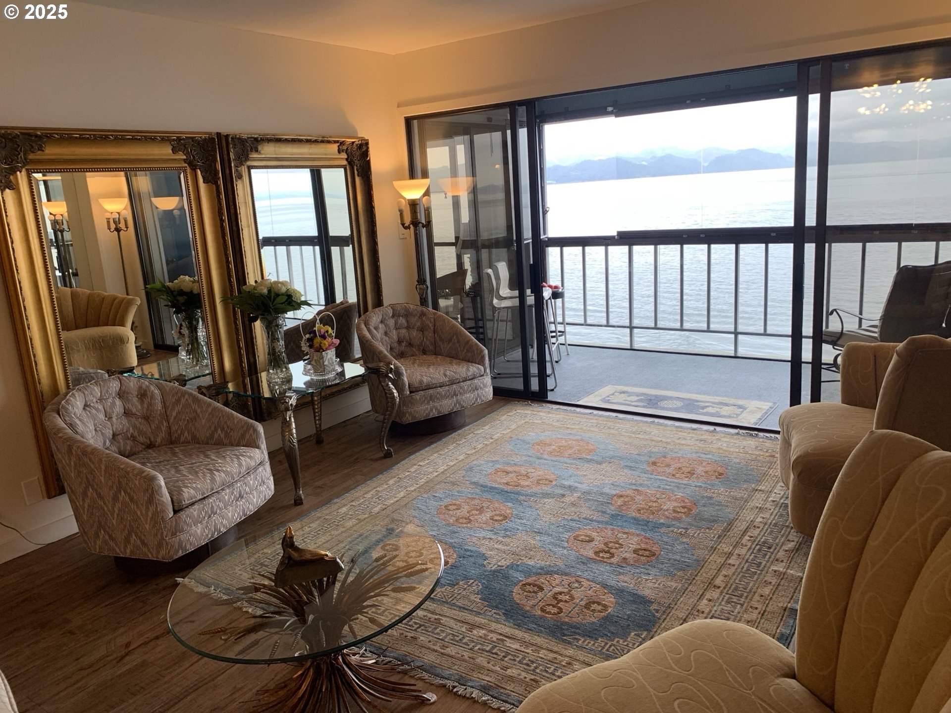 1 3rd Street, Unit 209 Astoria, OR 97103 - Photo 37 of 37 a living room with furniture and a floor to ceiling window