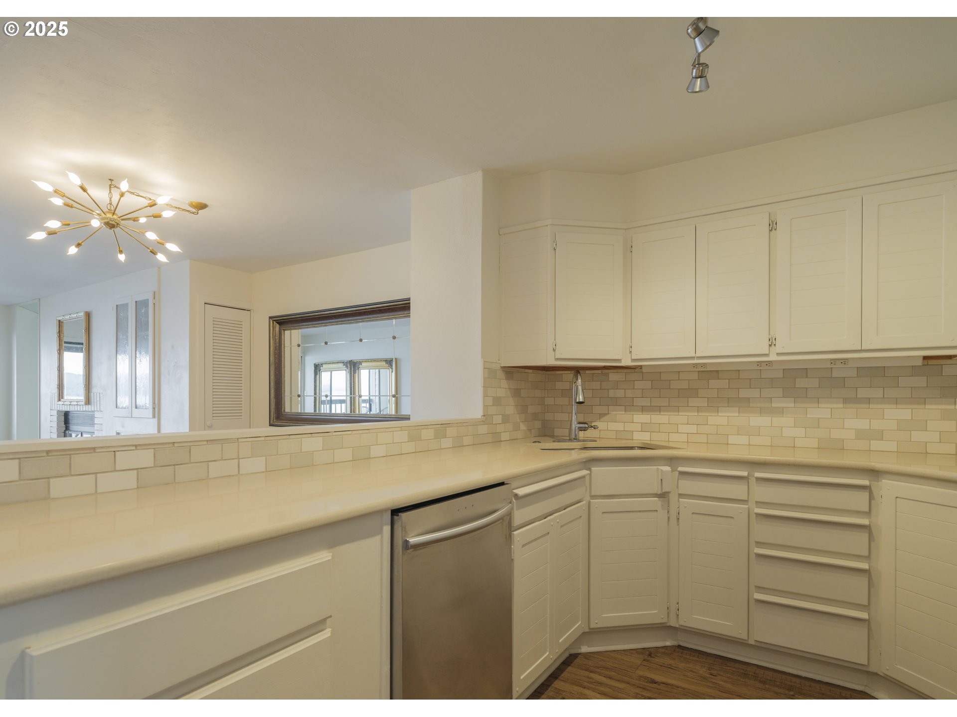 1 3rd Street, Unit 209 Astoria, OR 97103 - Photo 10 of 37 a kitchen with a sink cabinets and window
