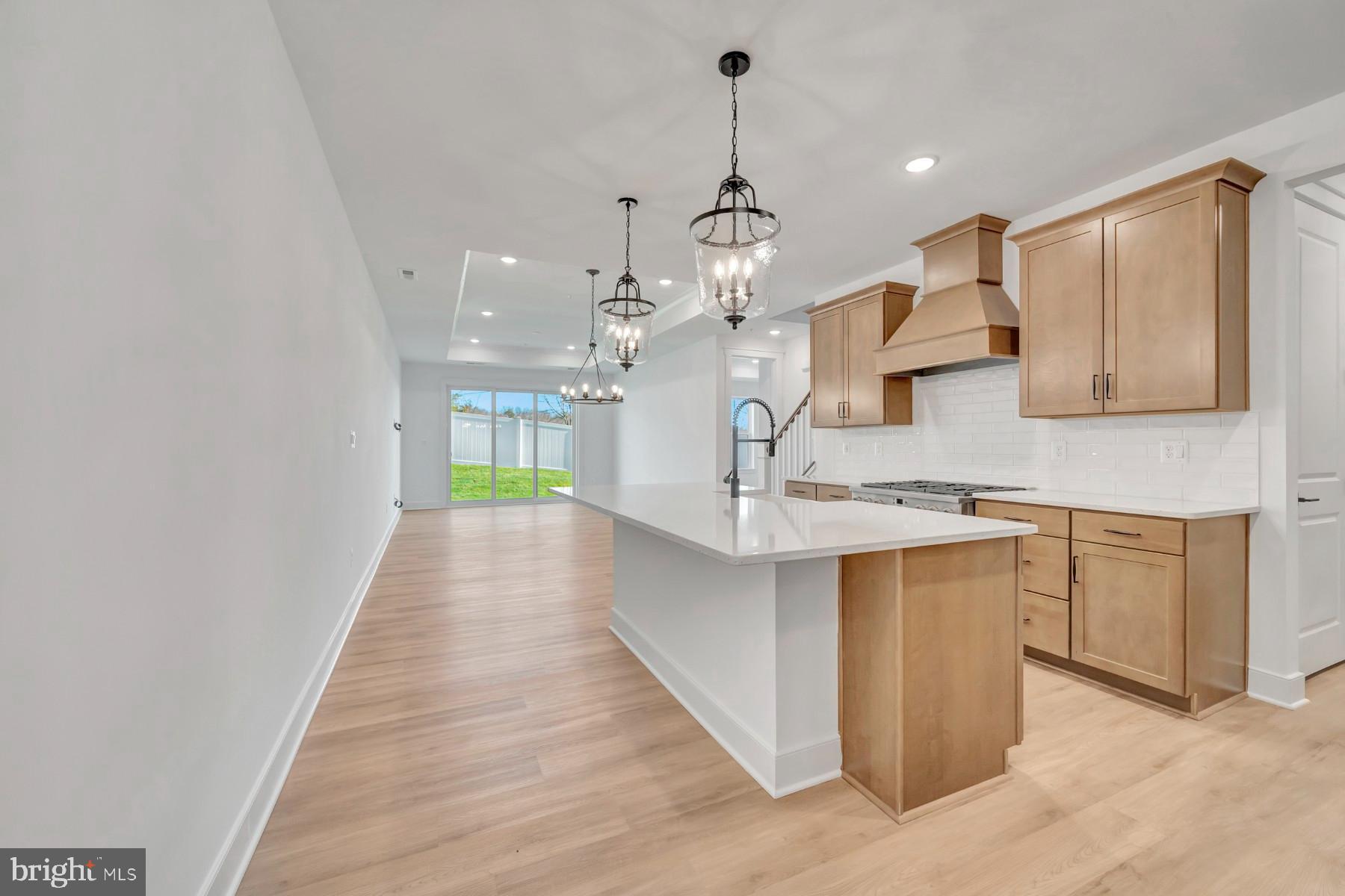 4803 Grandiflora Circle Perry Hall, MD 21128 - Photo 15 of 30 a large kitchen with kitchen island a sink stainless steel appliances and cabinets