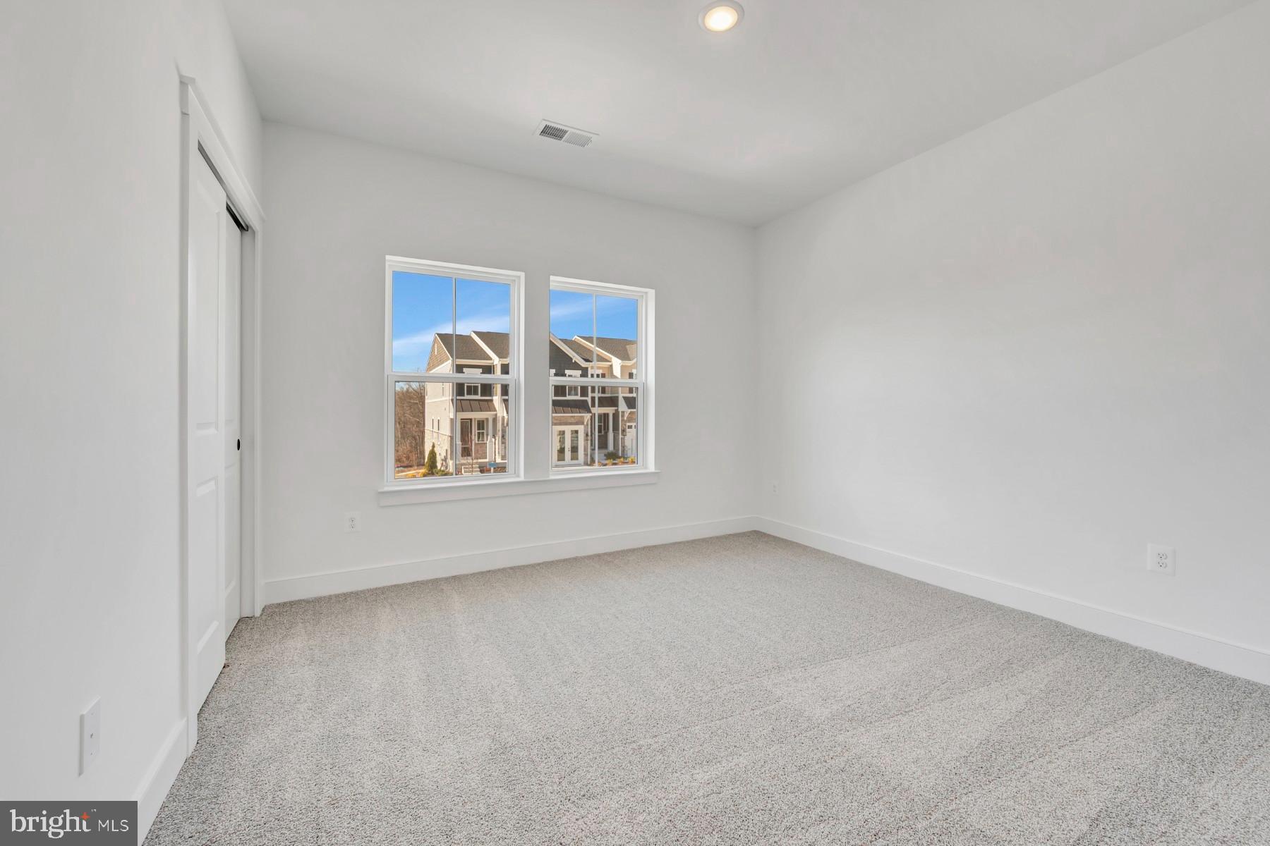 4803 Grandiflora Circle Perry Hall, MD 21128 - Photo 21 of 30 a view of an empty room with a window