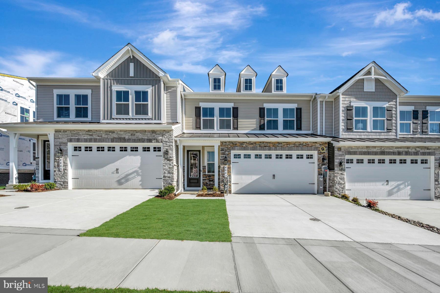 4803 Grandiflora Circle Perry Hall, MD 21128 - Photo 3 of 30 a front view of a house with a yard and garage