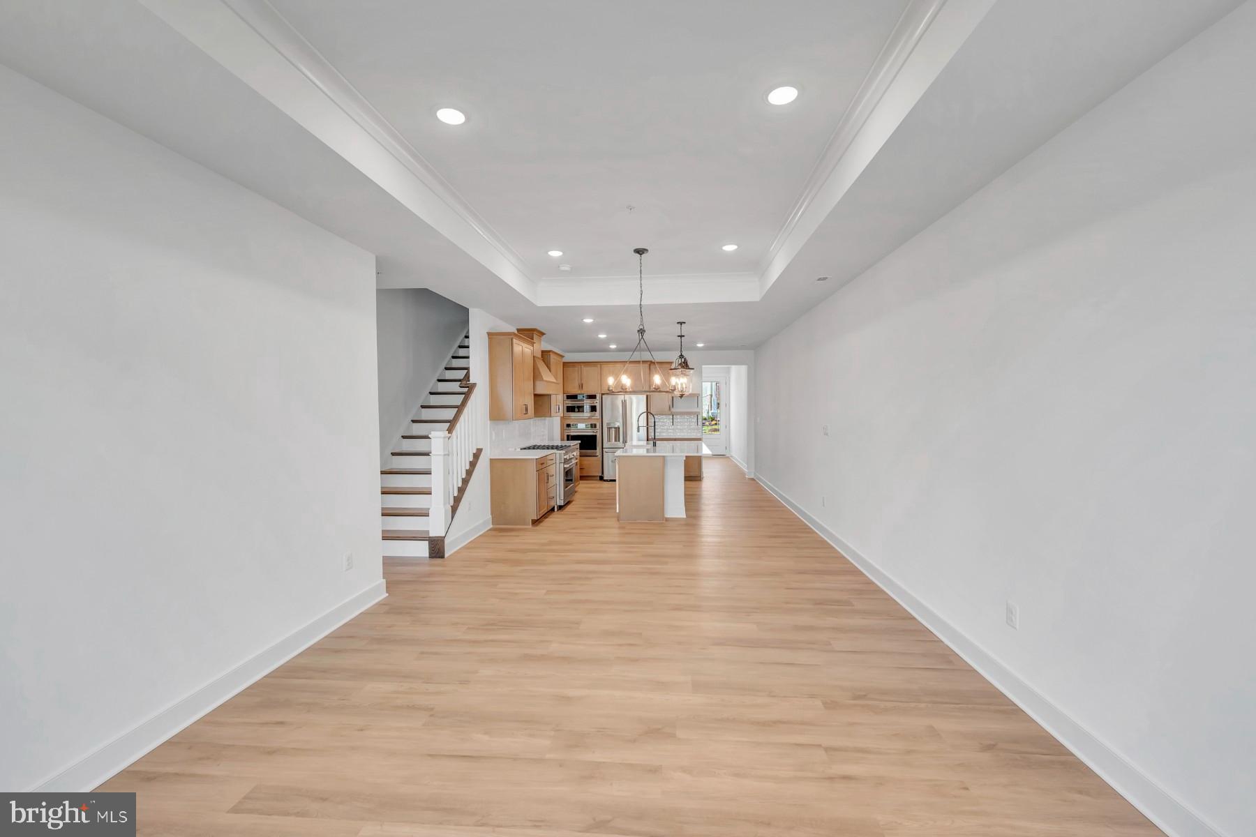 4803 Grandiflora Circle Perry Hall, MD 21128 - Photo 7 of 30 a view of an empty room with wooden floor