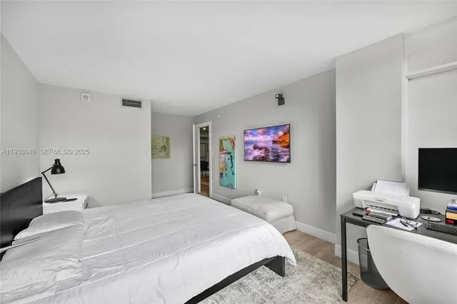 a bathroom with a double vanity sink mirror and shower