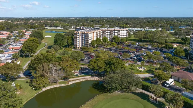 an aerial view of residential house with outdoor space and river