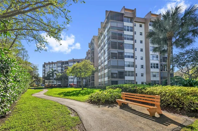 a view of a parked cars in front of a building
