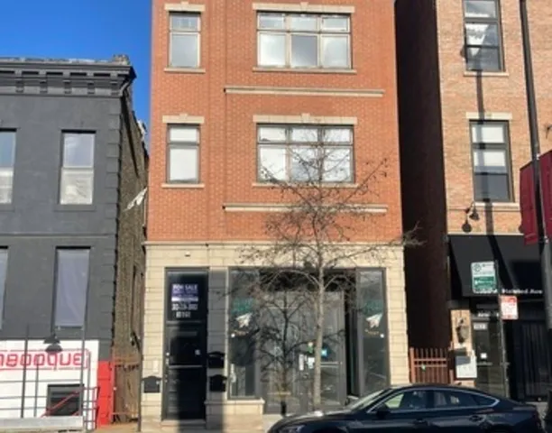 a front view of a building with a glass door