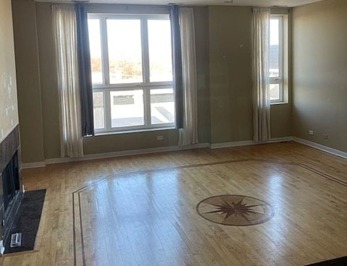 1625 North Halsted Street Chicago, IL 60614 - Photo 5 of 9 an empty room with wooden floor and windows