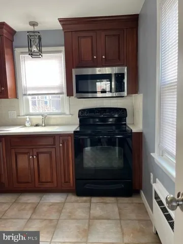 a kitchen with a stove and a microwave