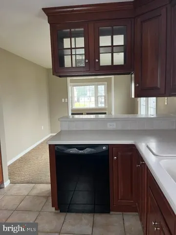 a kitchen with a cabinets and window