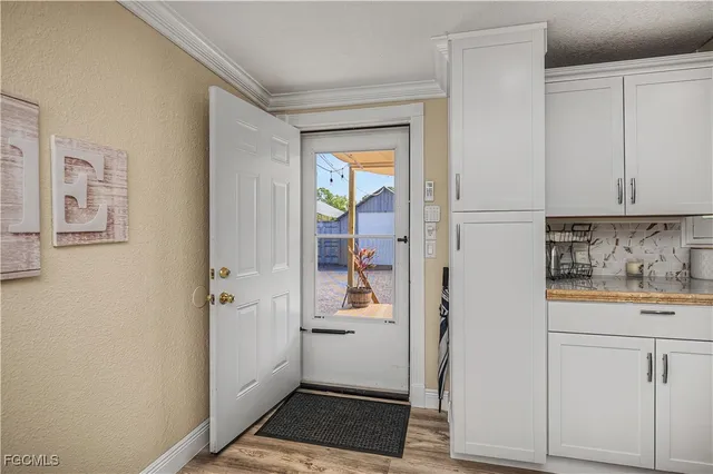 a kitchen with a refrigerator and cabinets