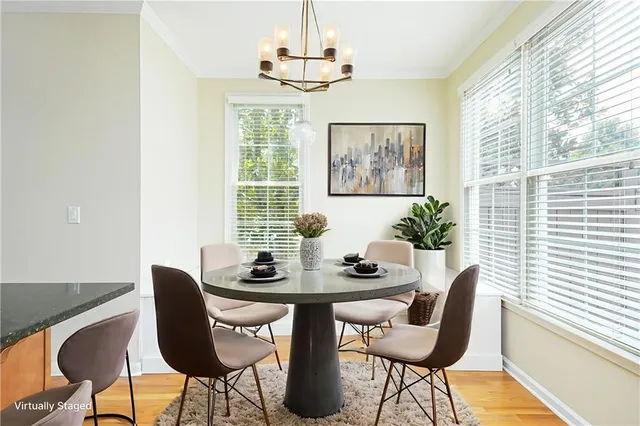 a dining room with furniture and window