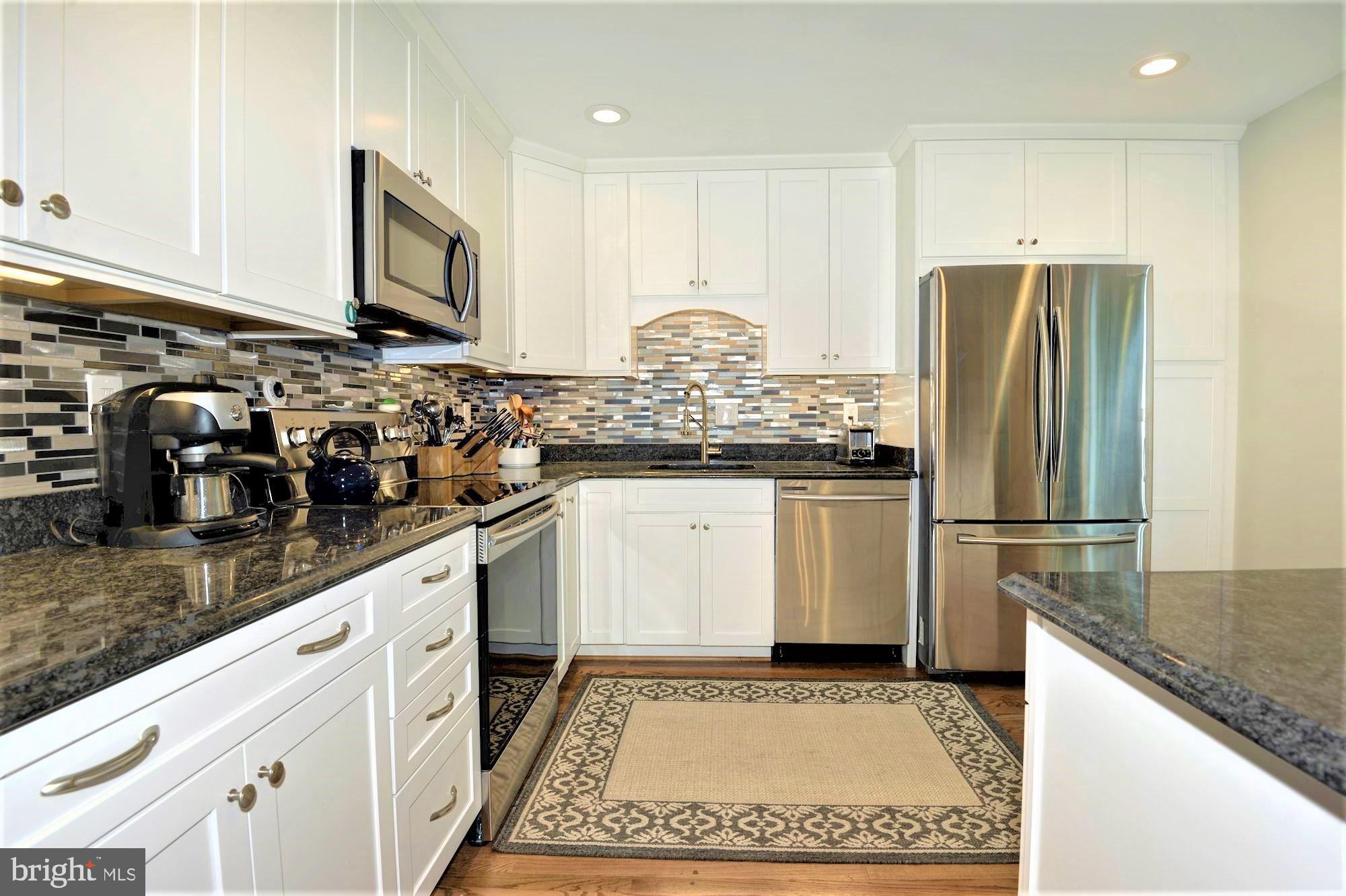 2305 Rosedown Drive Reston, VA 20191 - Photo 15 of 43 brand new kitchen with granite and backsplash